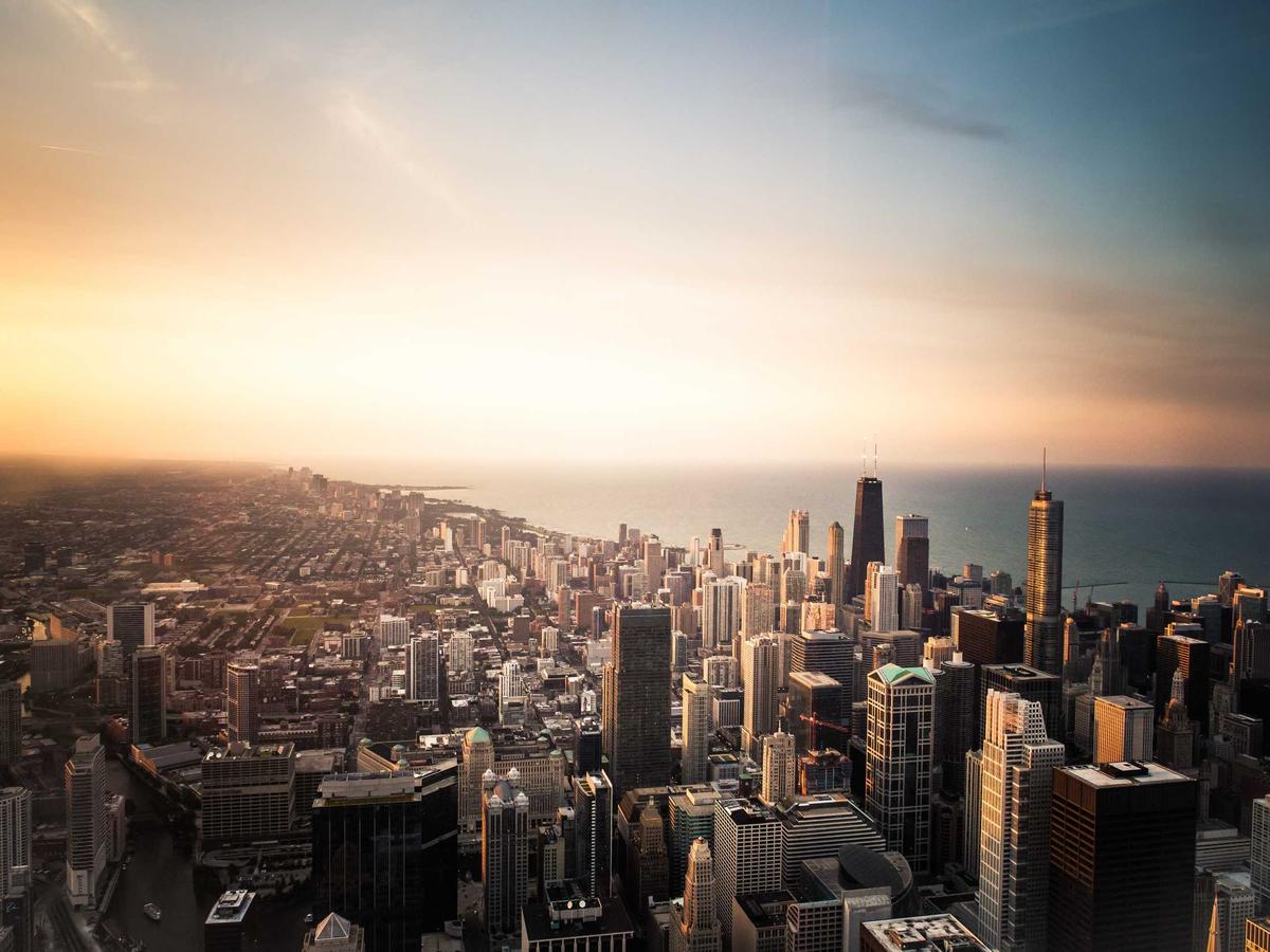 City skyline at golden hour, representing business growth